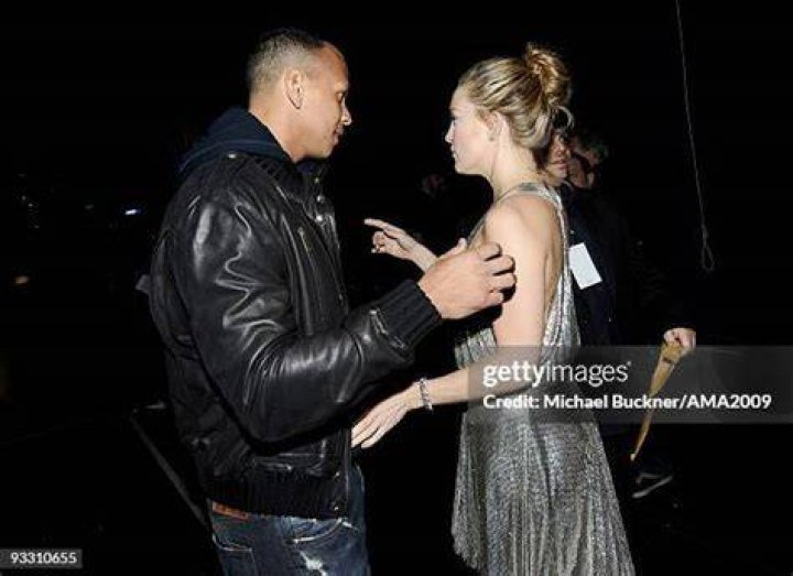 Alex Rodriguez and actress Kate Hudson kissing at Yankees Family Picnic Day in 2009