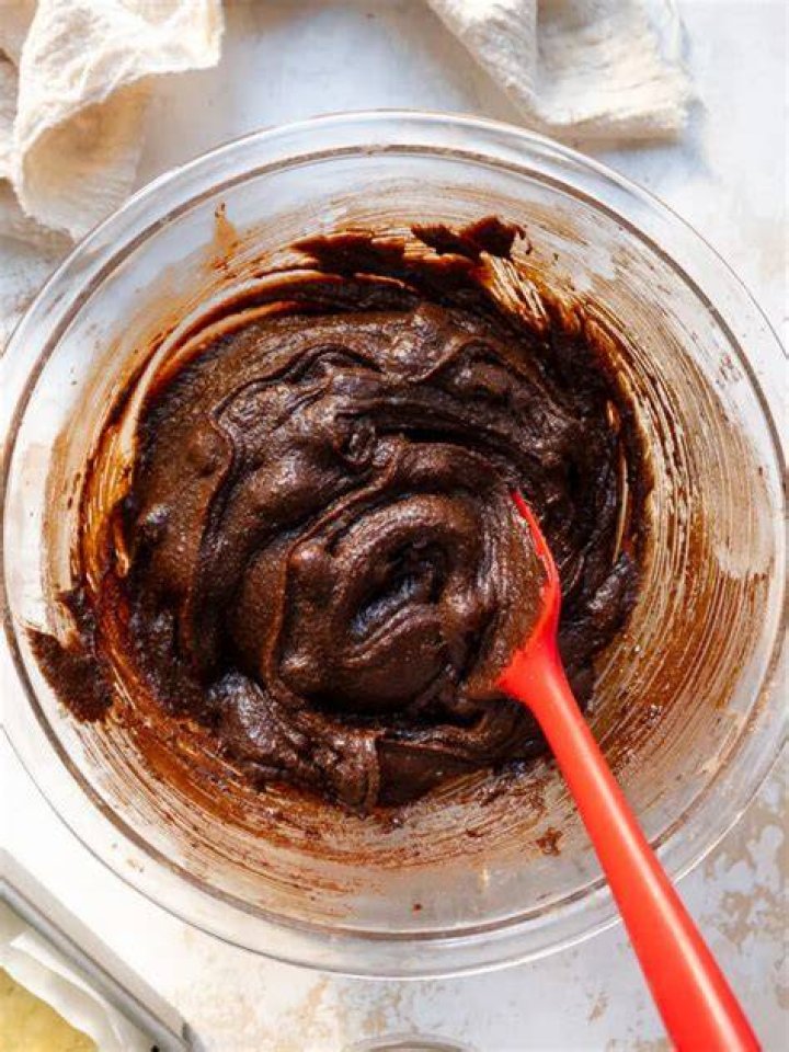 Brownie batter in a large white bowl
