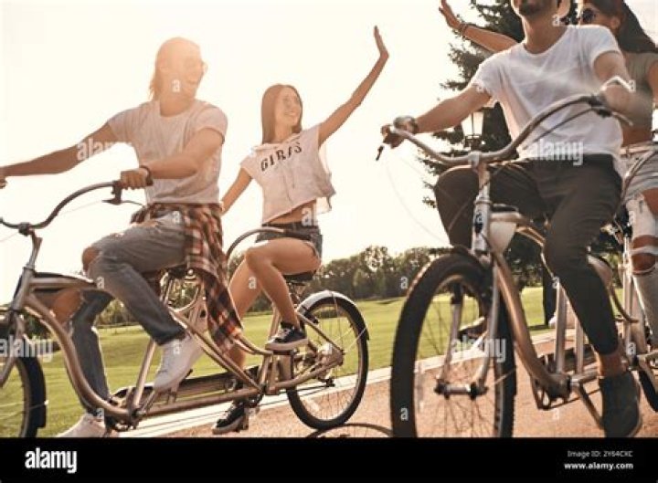 cycling classmates giving each other high five
