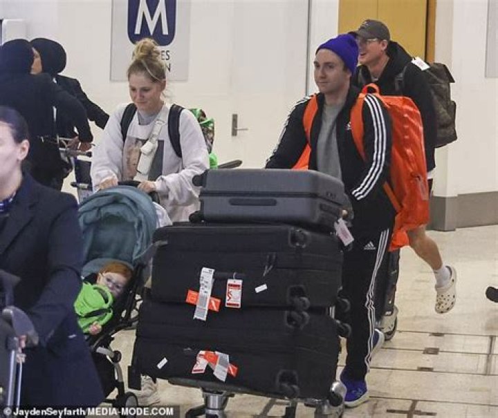 Daryl meanwhile kept cosy in a grey shirt and black and white striped Adidas jacket