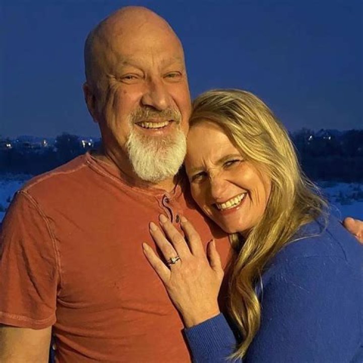 David Woolley and Christine Brown pose together following their engagement; the couple's wedding took place on Oct. 7, 2023.
