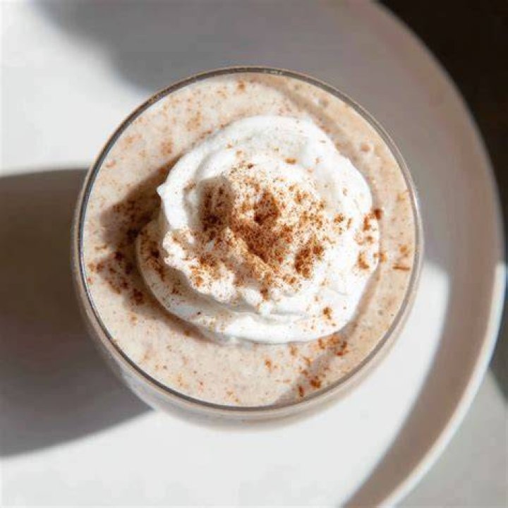 Gingerbread smoothie topped with whipped cream.