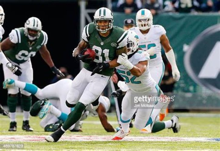 Kellen Winslow at a 2013 Jets practice on a bicycle.
