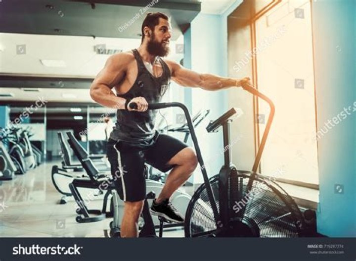 man on exercise bike in gym