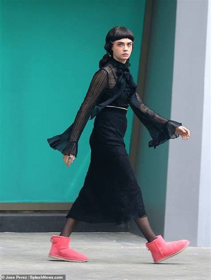 New look: Cara sported a quirky colourful punk mohawk wig