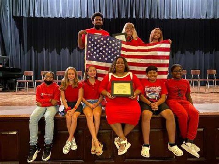 New MMS principal with flag flown over Capitol Henry County Enterprise