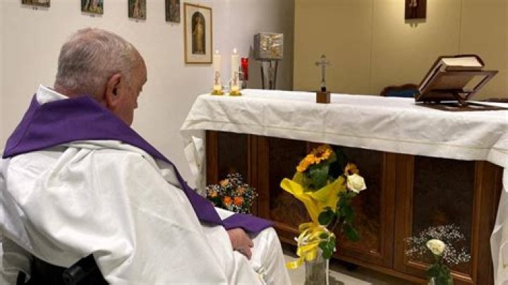 Pope Francis' bodyguards escorted him as he arrived in the popemobile car on April 20 for the general audience.