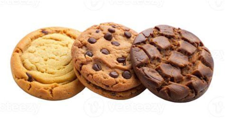 Stack of three cookies topped with pastel M&M's and sprinkles.