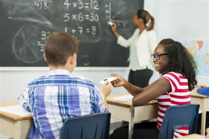 Student in math class with a calculator.