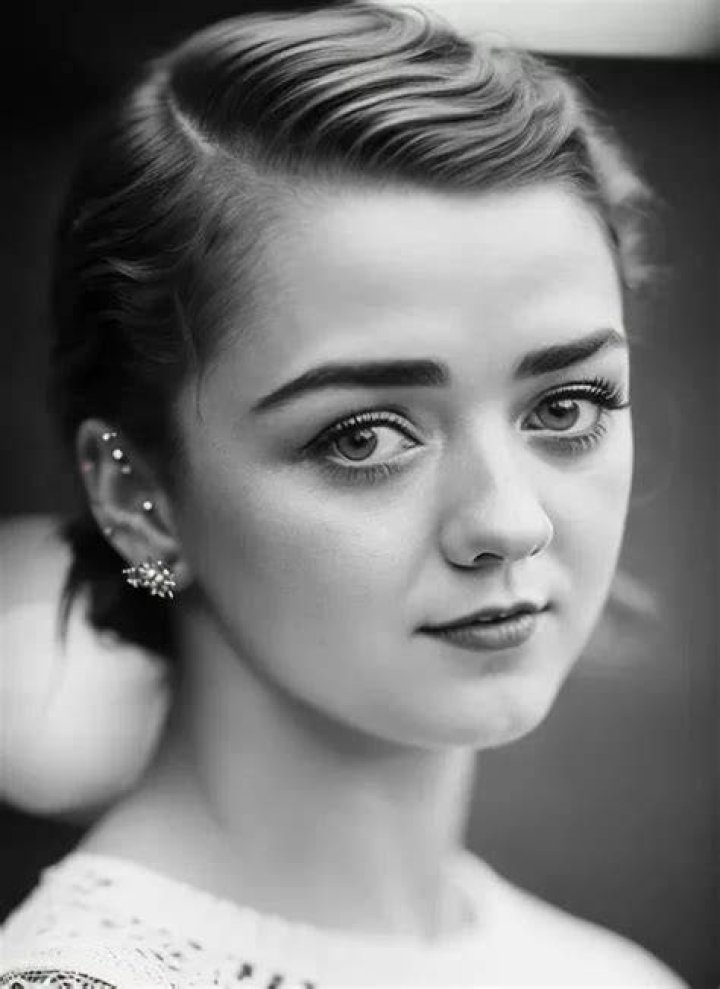 Style:&nbsp;Another notable photograph saw Maisie posing up a storm in a matching navy Gucci jacket and jeans, which she teamed with a Paco Rabanne frilled top and orange Pariah hoop earrings